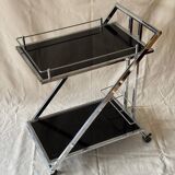 Modernist serving trolley in chromed metal and black smoked glass