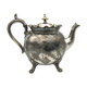 Old teapot pourer in silver metal decorated with foliage and butterflies