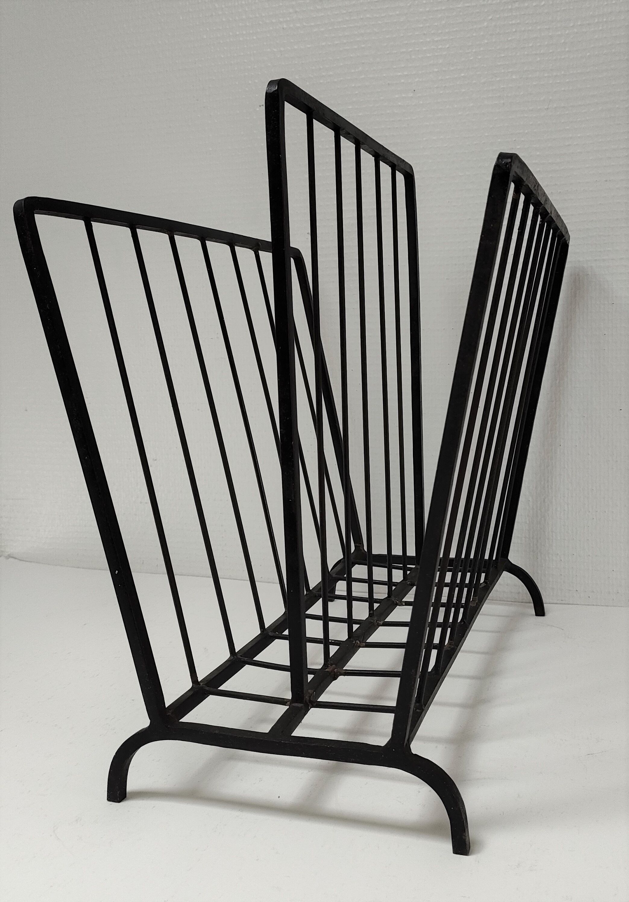 Modernist magazine holder black iron 60s