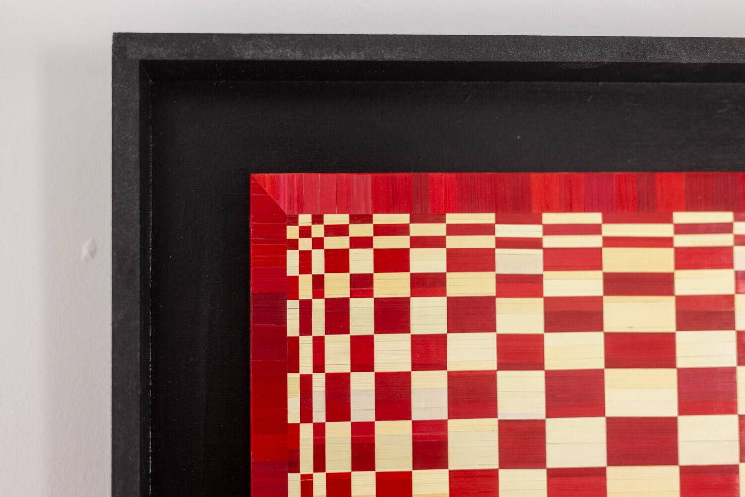 Pair of panels in red and gold straw marquetry. Contemporary.