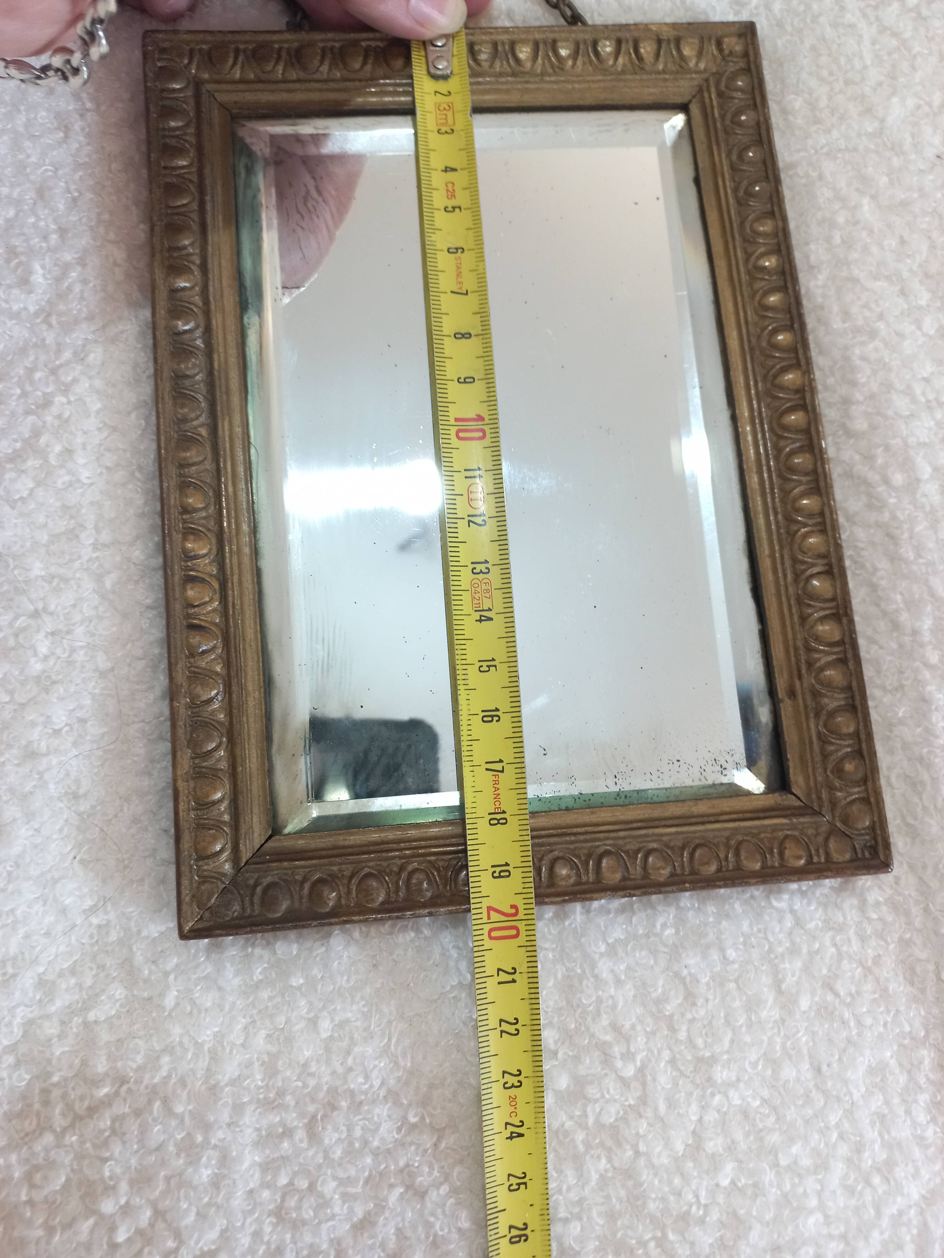 Small vintage mirror in gilded wood, bevelled glass with chain.