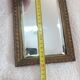 Small vintage mirror in gilded wood, bevelled glass with chain.