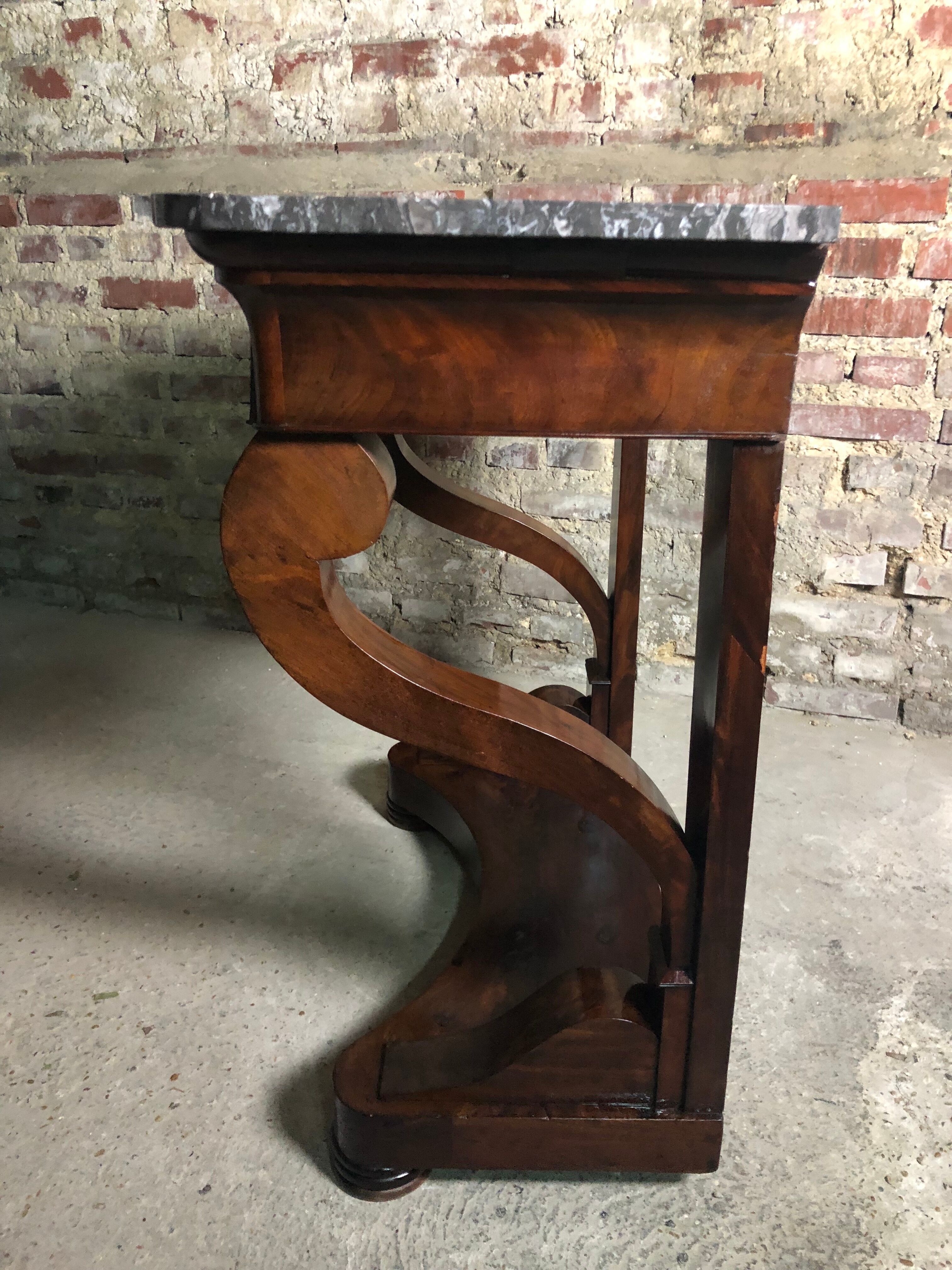 Console era restoration in mahogany veneer with St. Anne marble top.