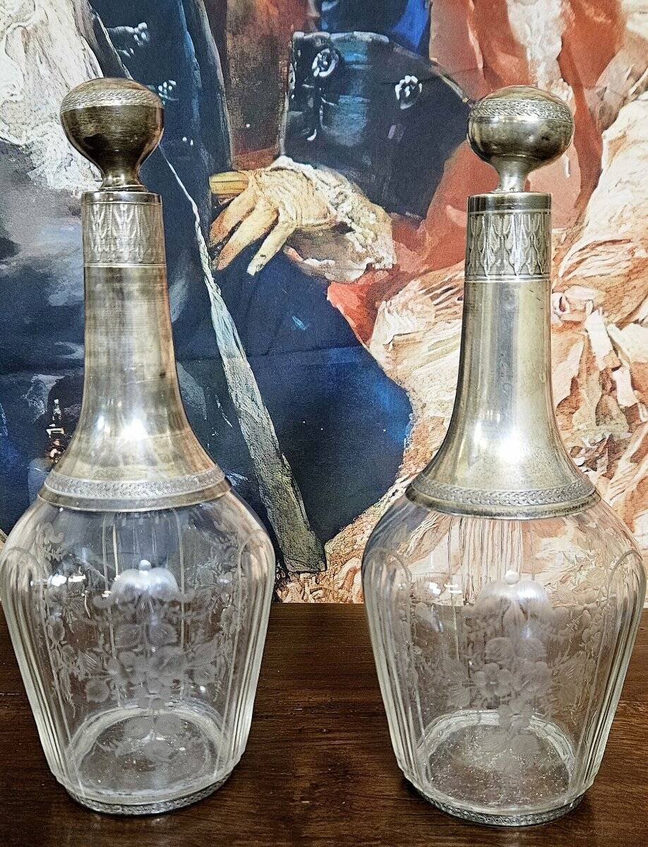 Pair of antique crystal and solid silver decanters.