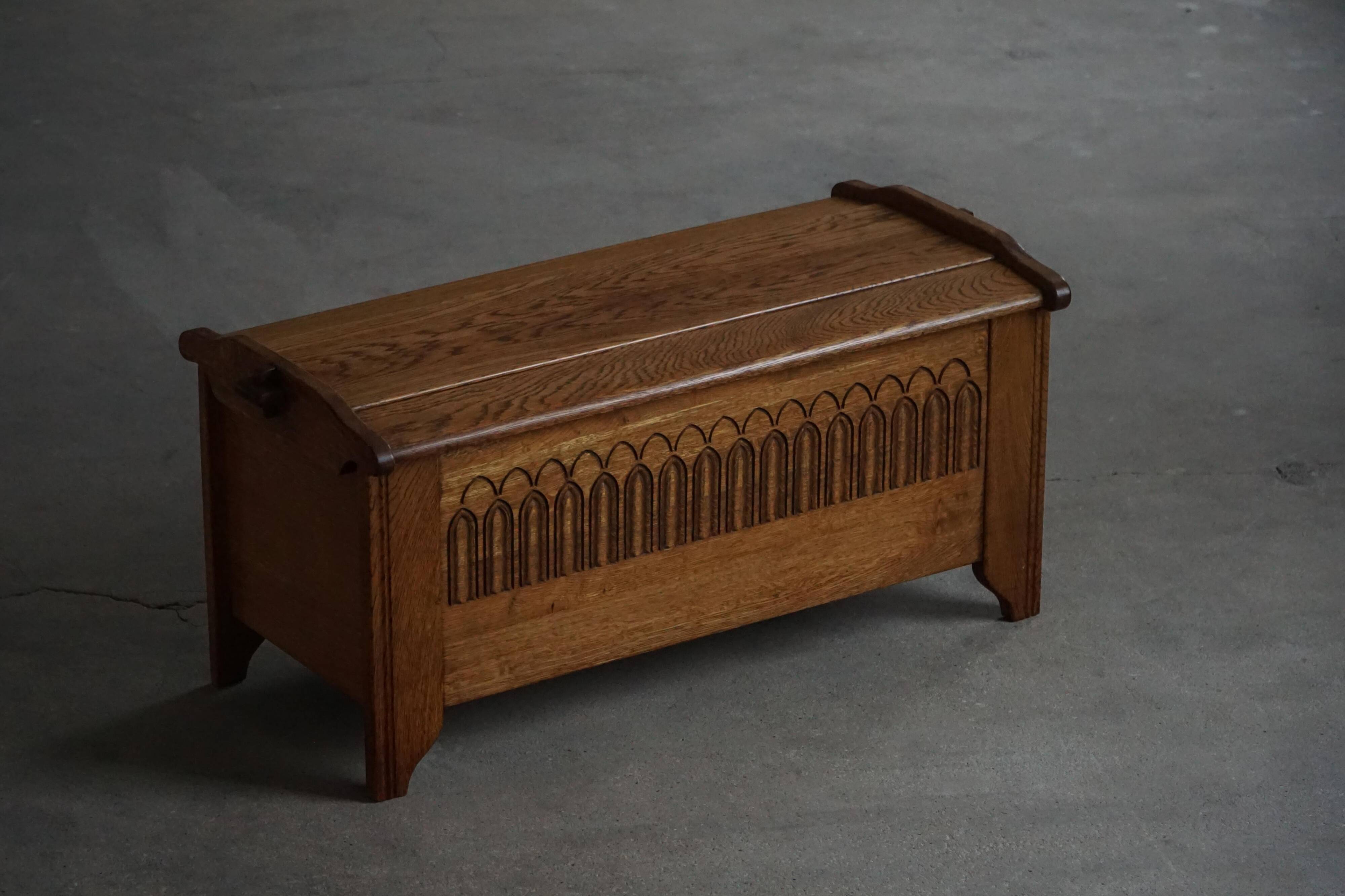 Modern Danish oak commode with decorative relief sculpture, mid-20th century.