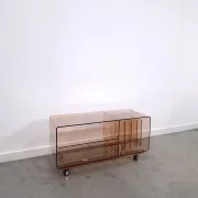 Vintage hifi, LP cabinet, TV unit made of tinted plexiglass on wheels, records.