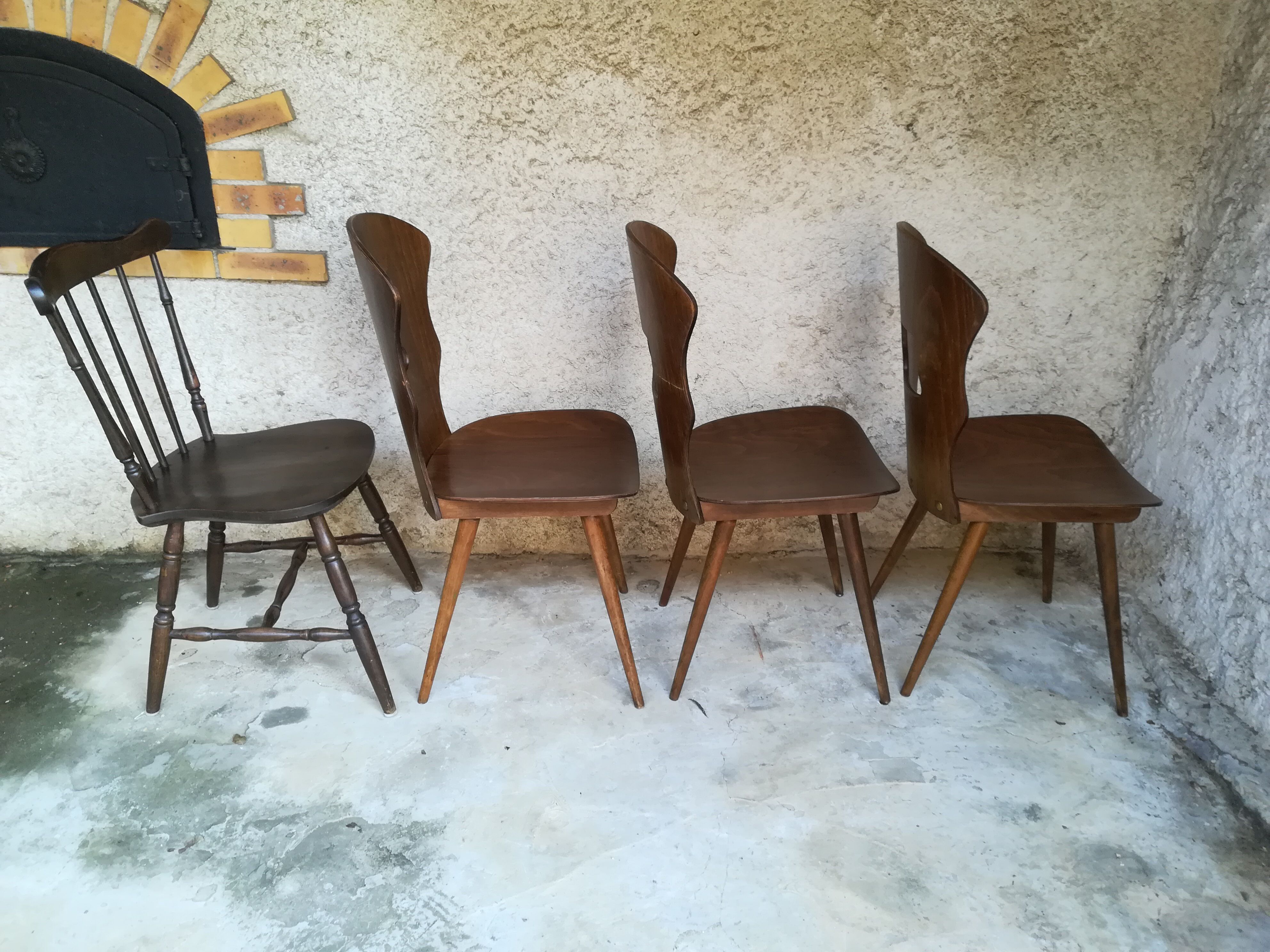 Eight mismatched bistro chairs