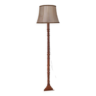 Carved wood floor lamp and leather lampshade