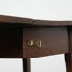 Charming antique English drop-leaf dining table made of oak from the late 19th century