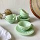 Pressed glass cups and saucers, 1950s