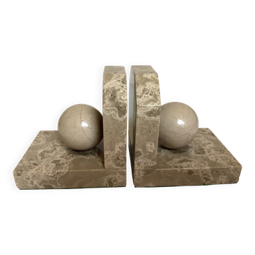 Pair of beige marble bookends.