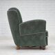 Fauteuil danois des années 1960, en laine de mobilier vert clair, avec des pieds en bois de chêne.