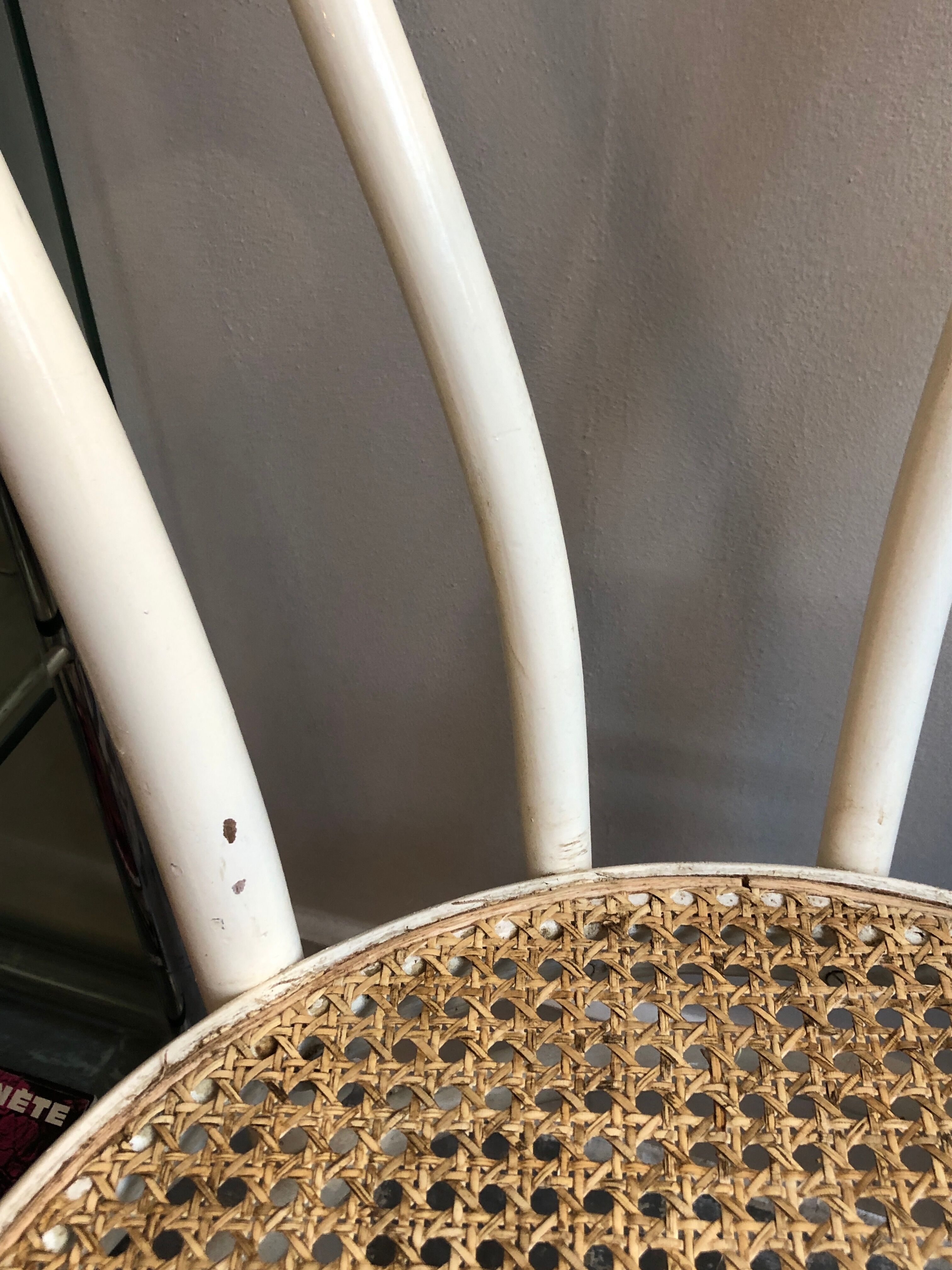 Couple of white bistro chairs