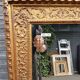 17th century Italian style gilded mirror in carved wood.
