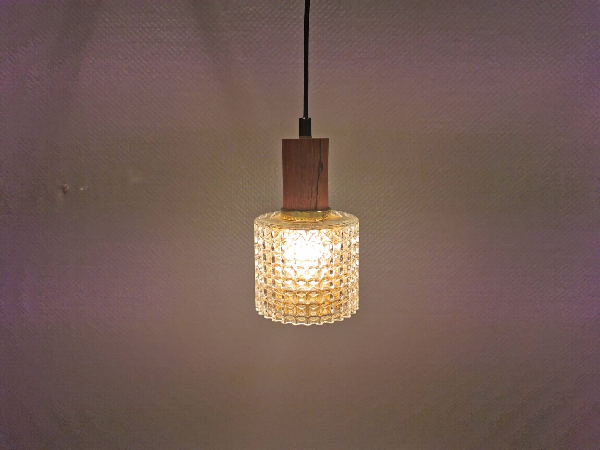 Older Swedish hanging lamp in multi-layered crystal glass with rosewood top and brass ring.