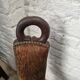 Antique tripod chair in solid wood and animal skin.