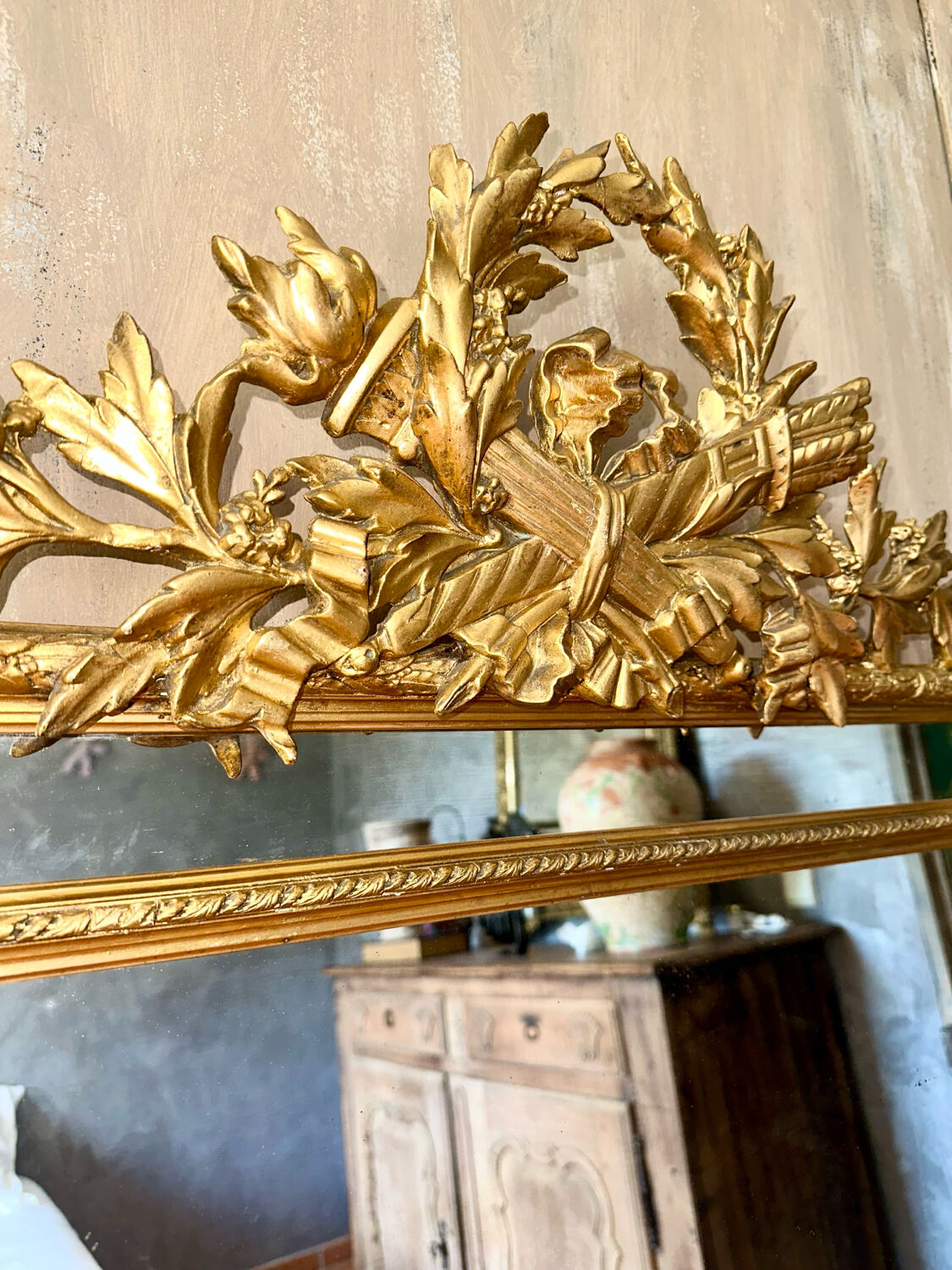 Antique gilded mirror with parcloses from the 19th century.
