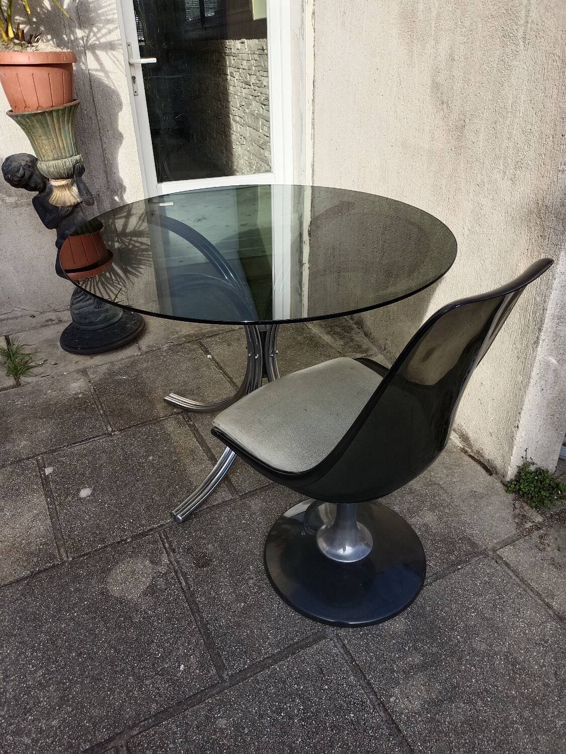 Chromed metal and smoked glass table