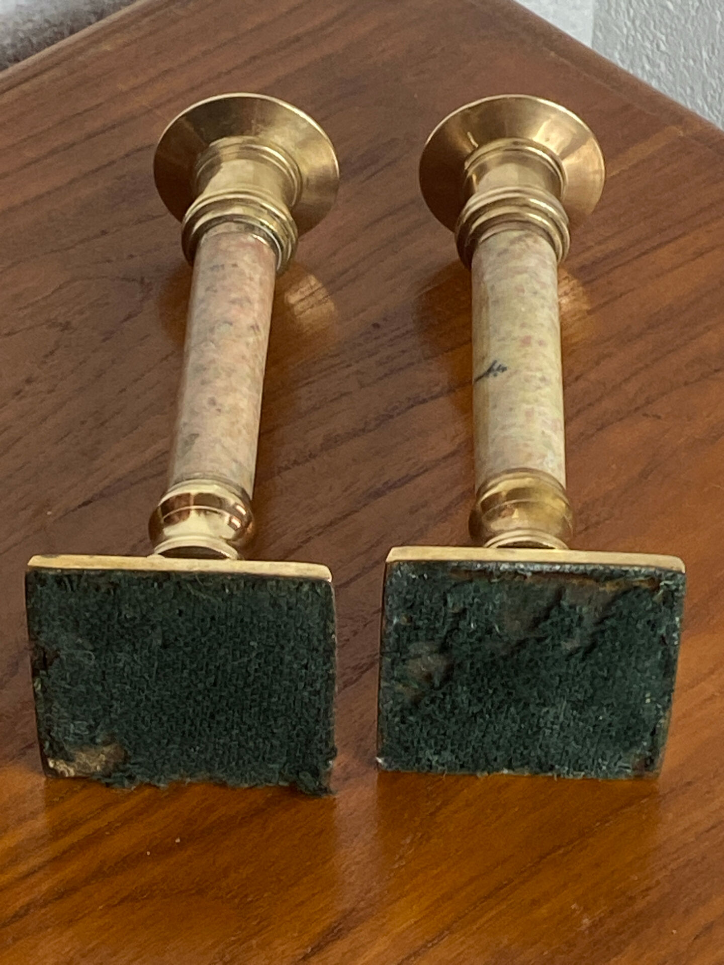Pair of brass and stone candlesticks