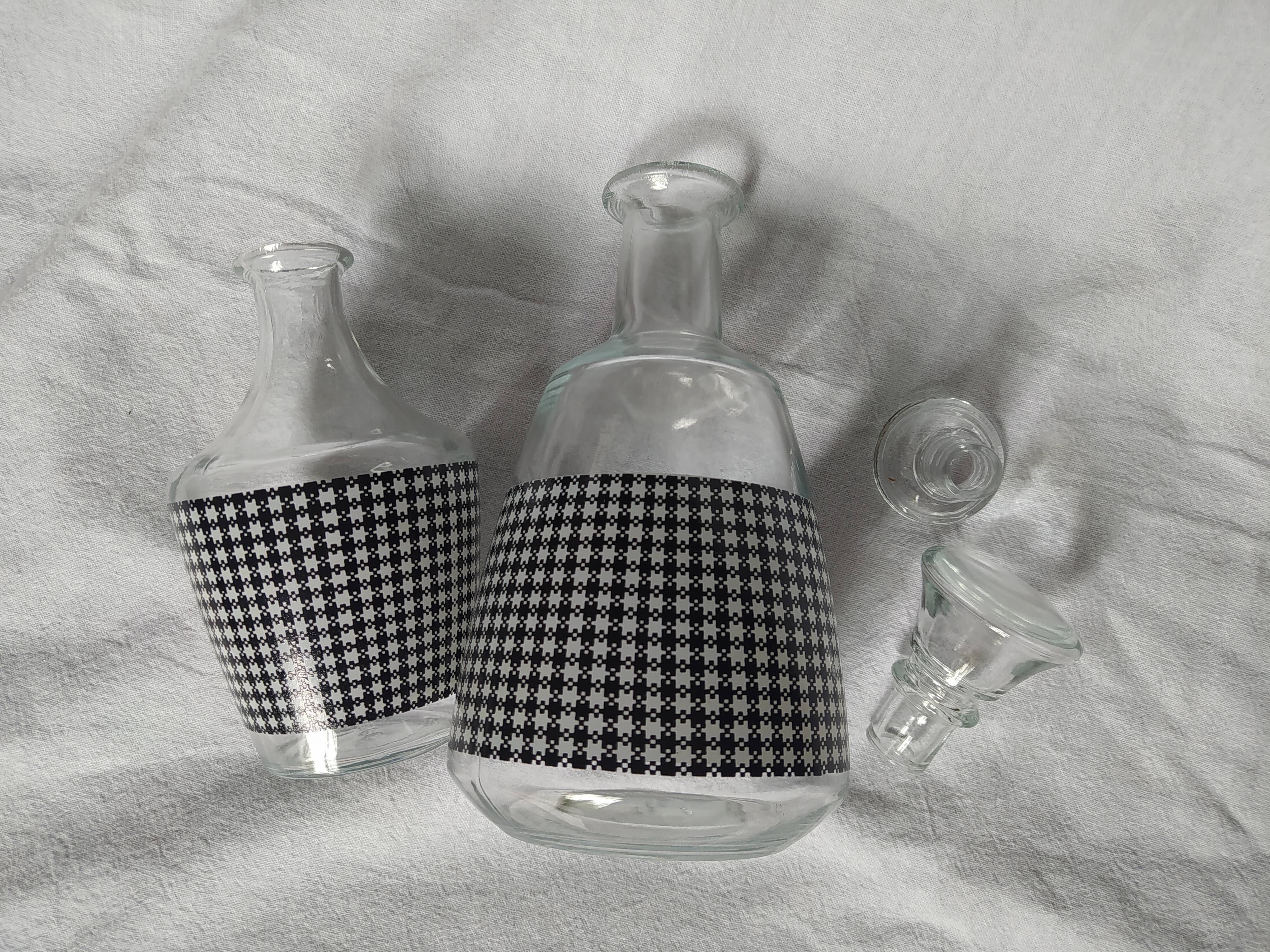 Set of 2 black and white houndstooth glass carafes from the Arques crystal factory. Rare.