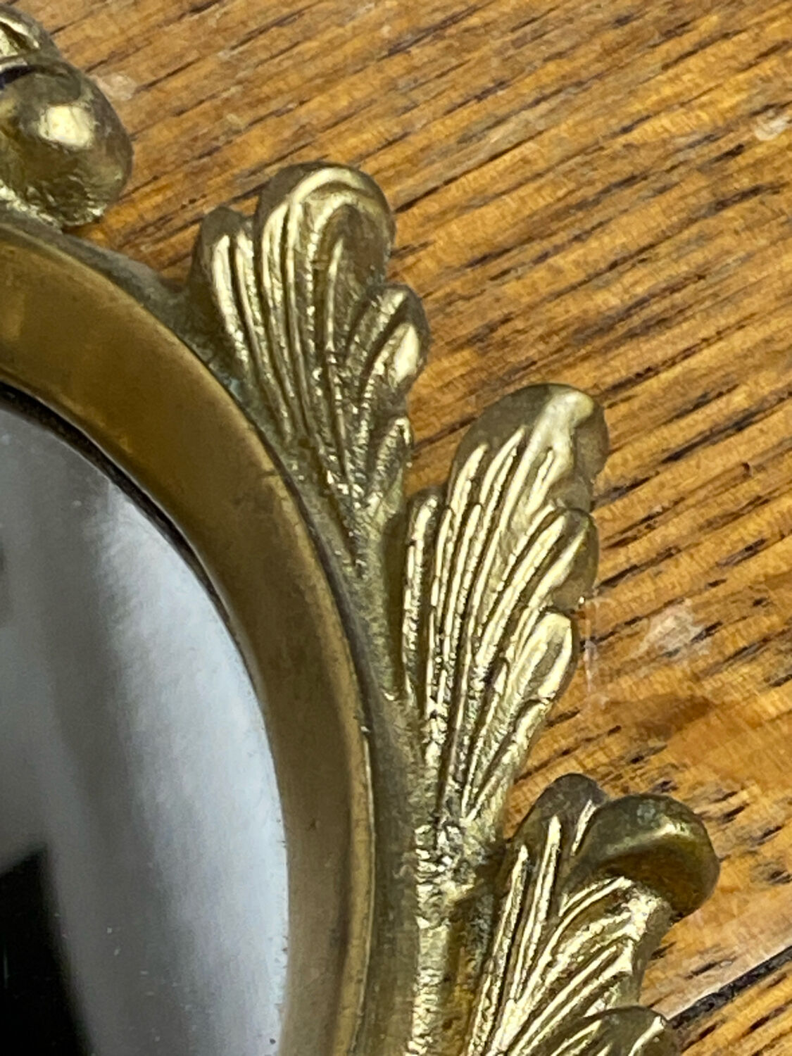 Small antique bronze mirror