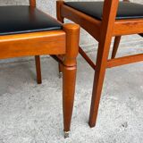 2 wooden and faux leather chairs in Scandinavian style