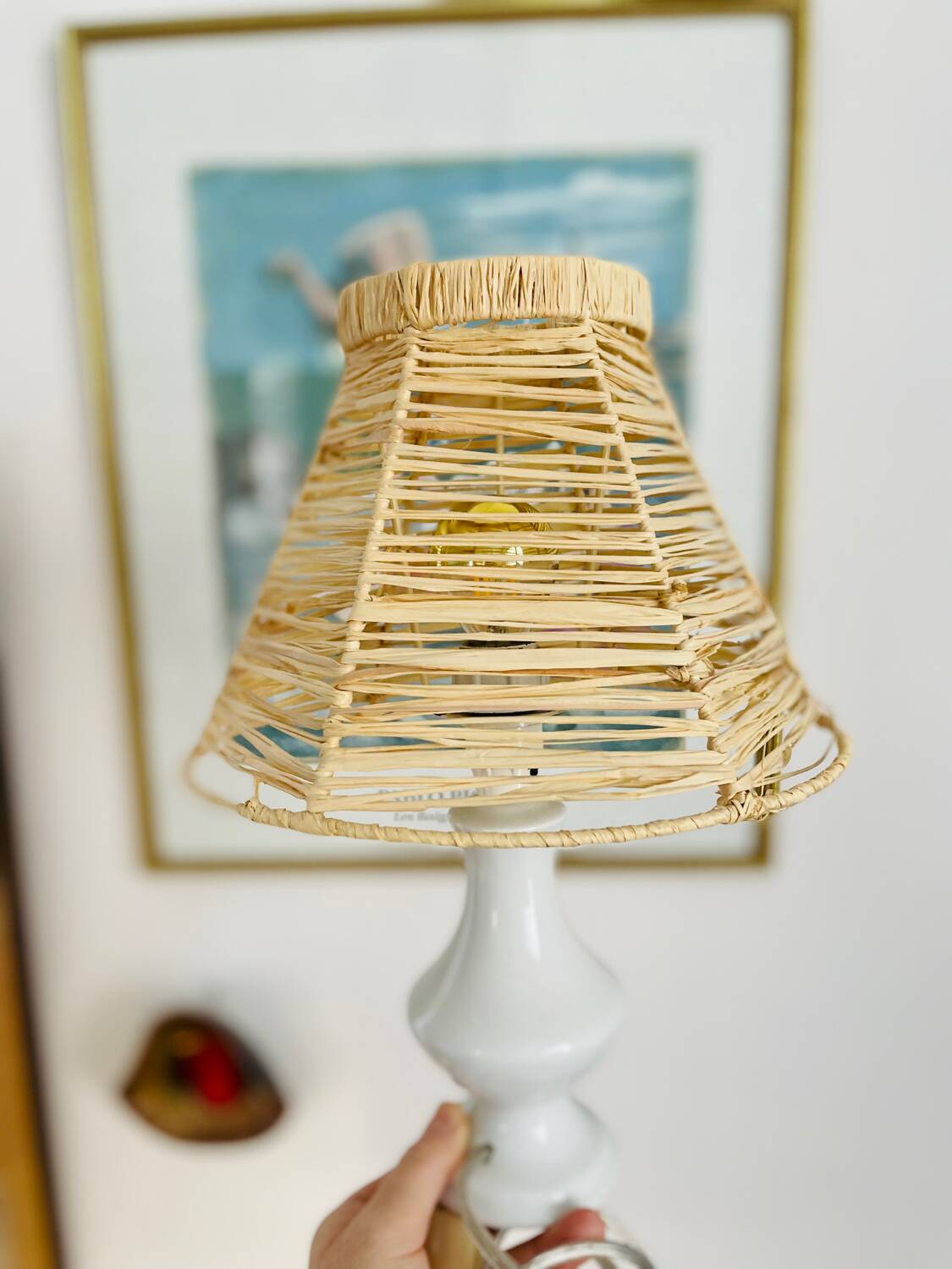 White porcelain table lamp and vintage raffia lampshade