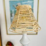 White porcelain table lamp and vintage raffia lampshade