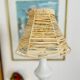 White porcelain table lamp and vintage raffia lampshade