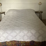 White cotton crochet bed cover with squares
