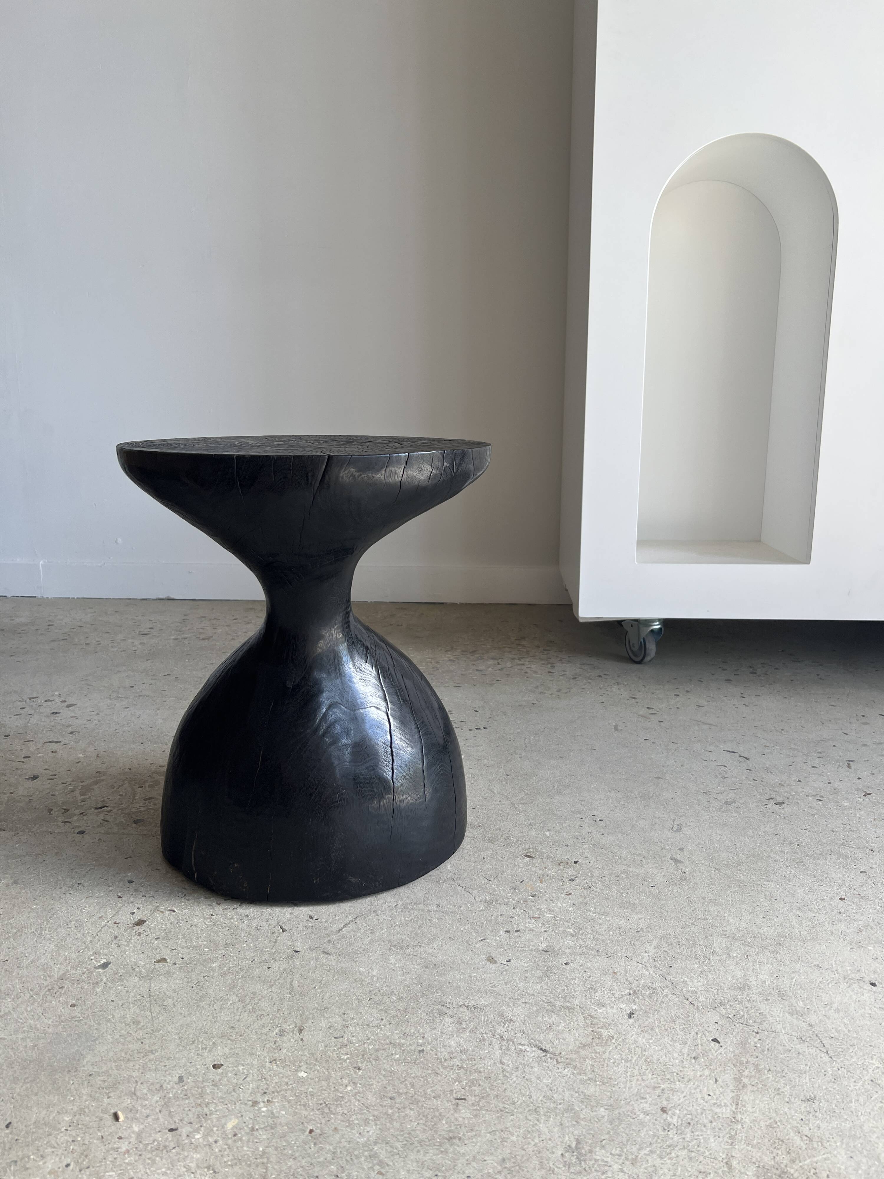 Solid wood (monoxyl) side table, organic shape, black color