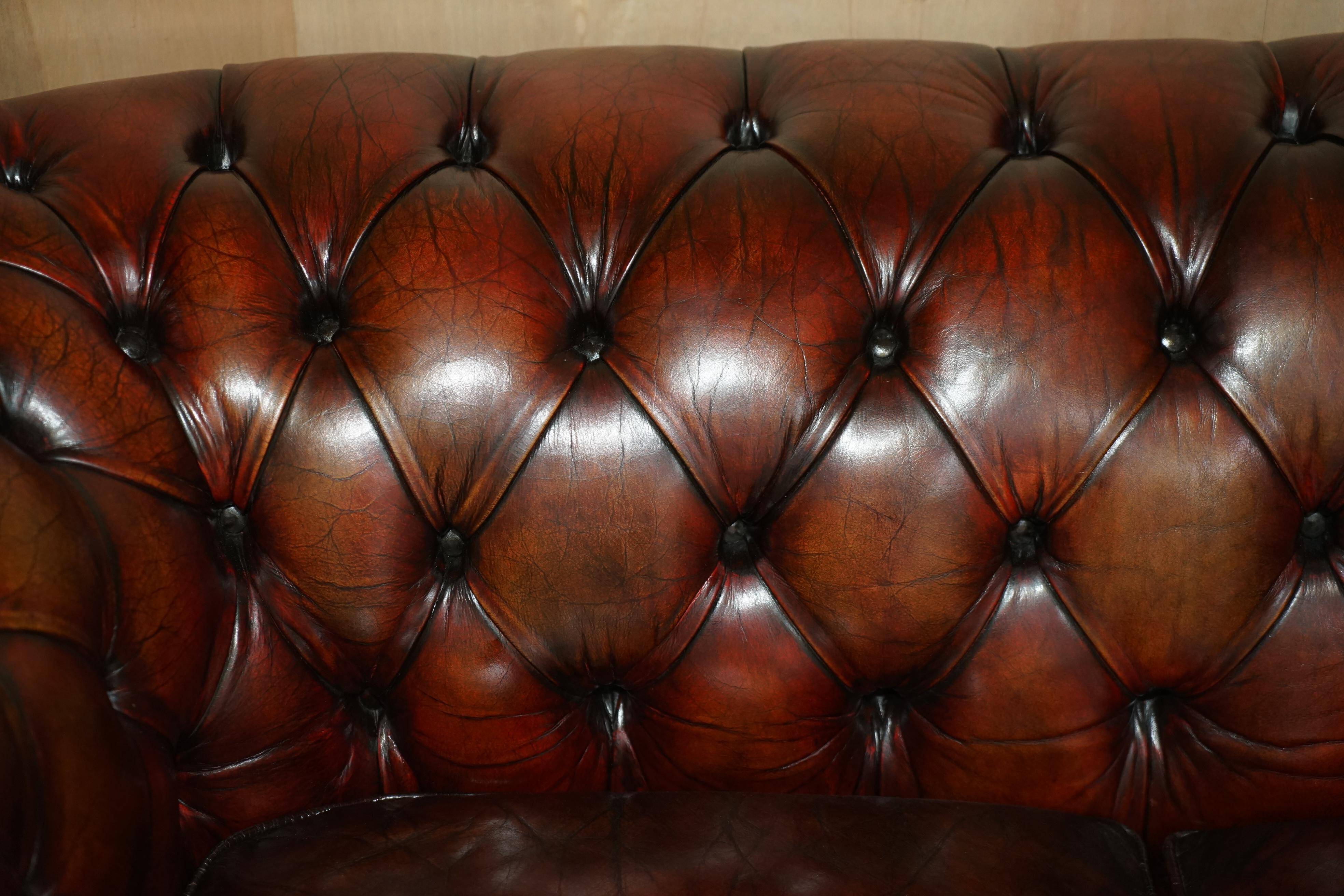 Pair of restored antique Chesterfield sofas in Boudreaux leather.