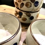 Enamelled stoneware tea bowls with plant decor