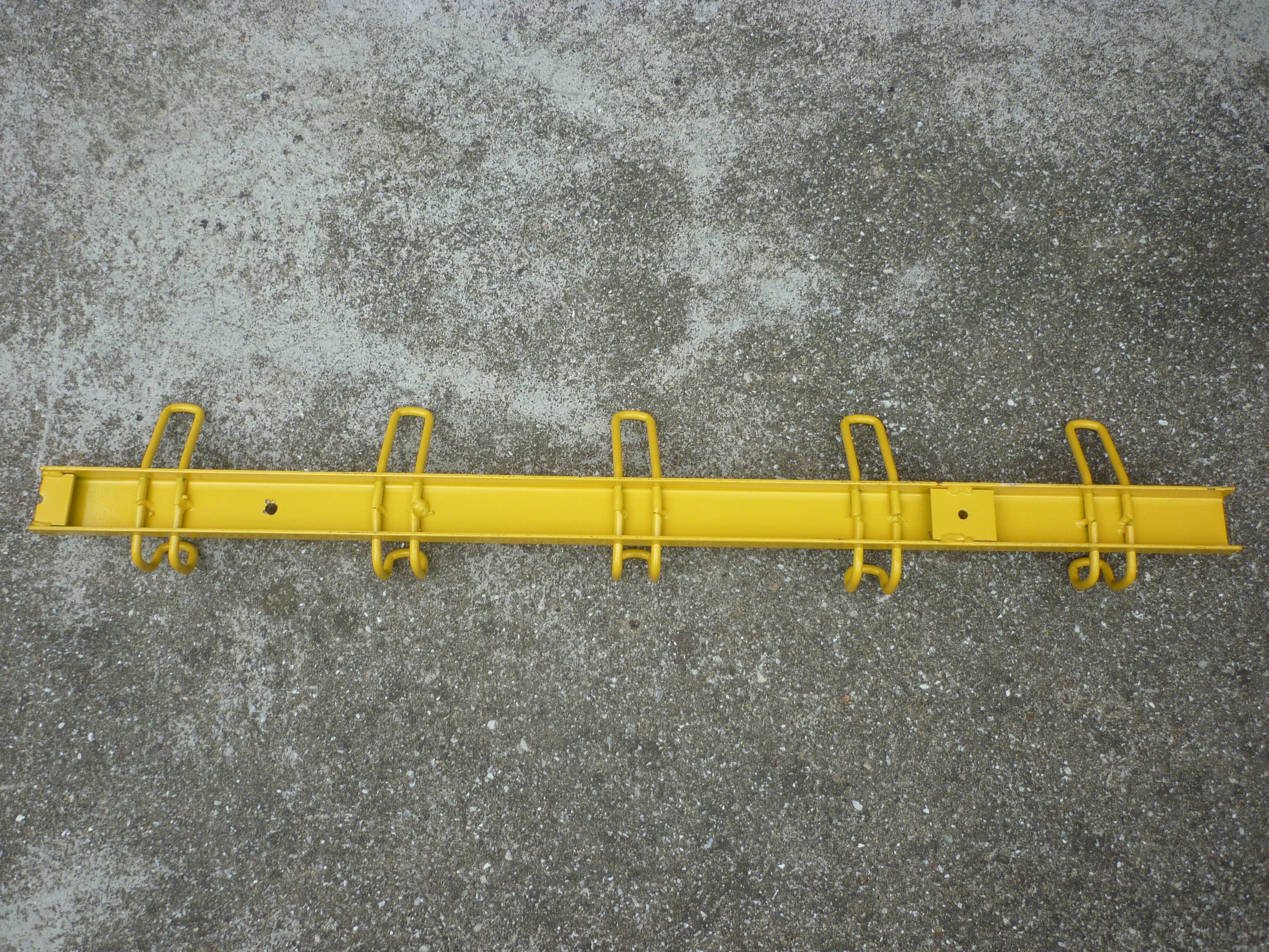 Yellow metal wall coat holder