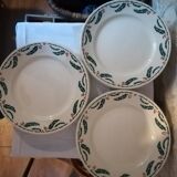Six flat earthenware plates decorated with holly