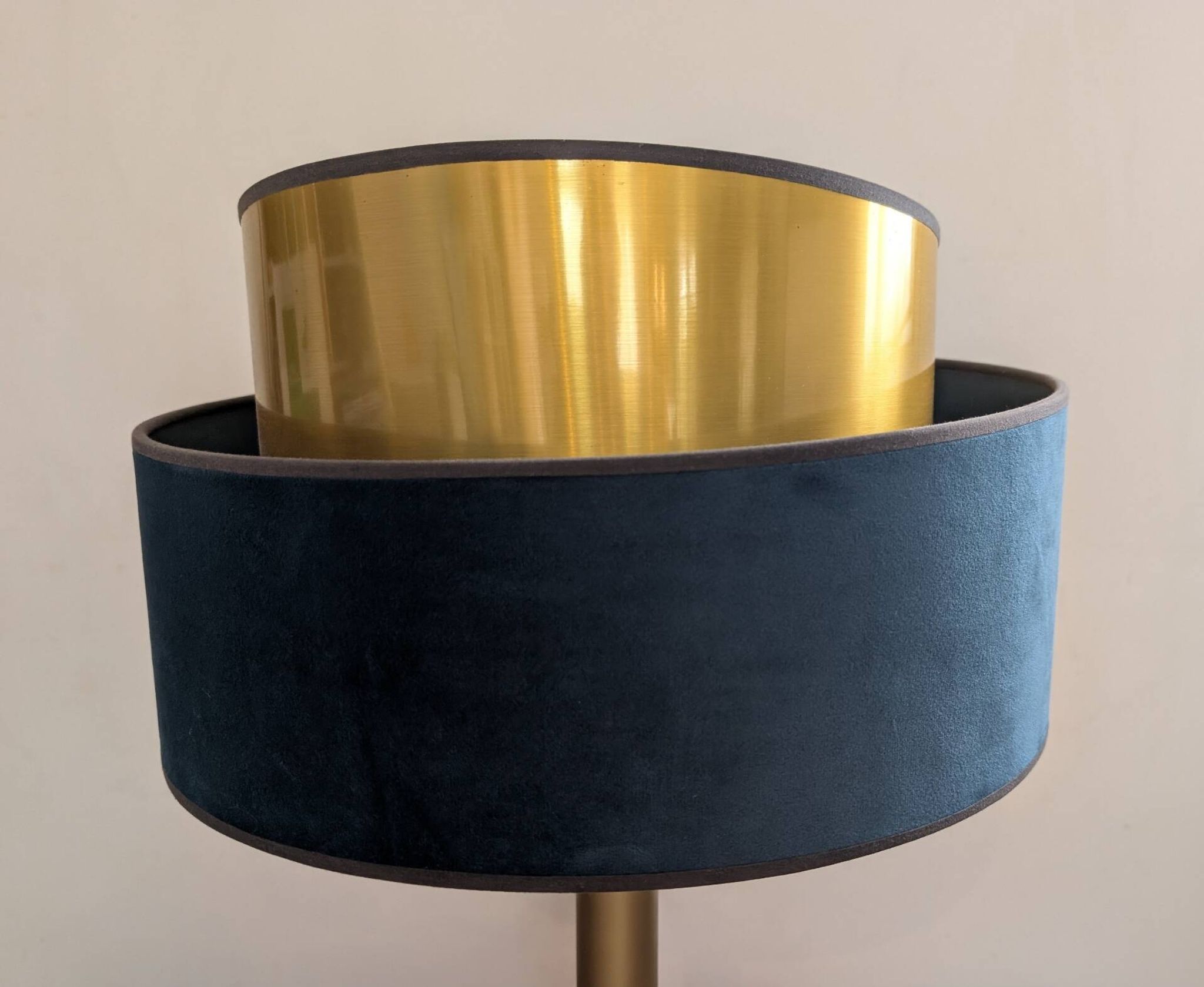 Brass lamp with asymmetrical velvet shade