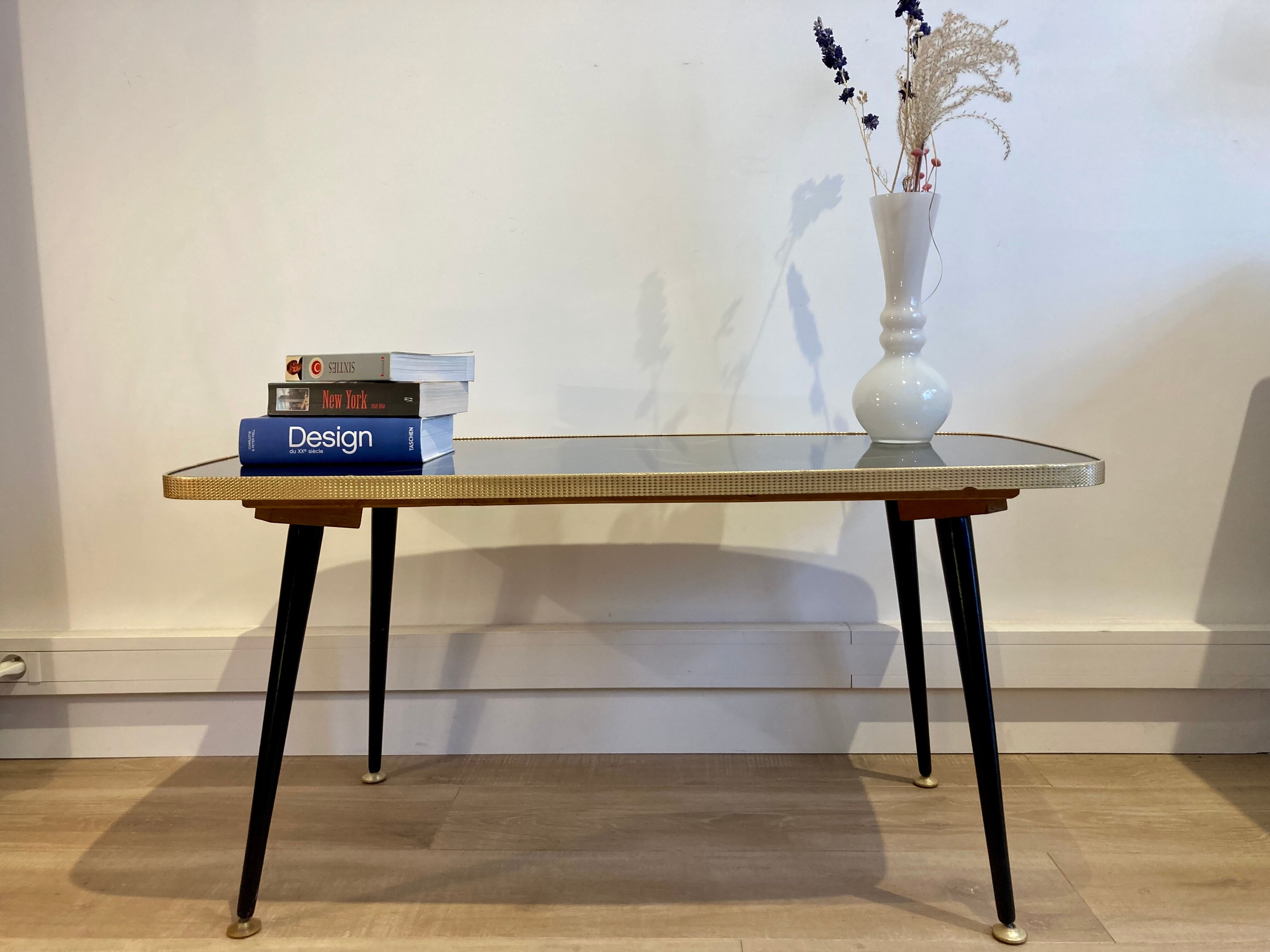 Black glass coffee table wooden legs 60s