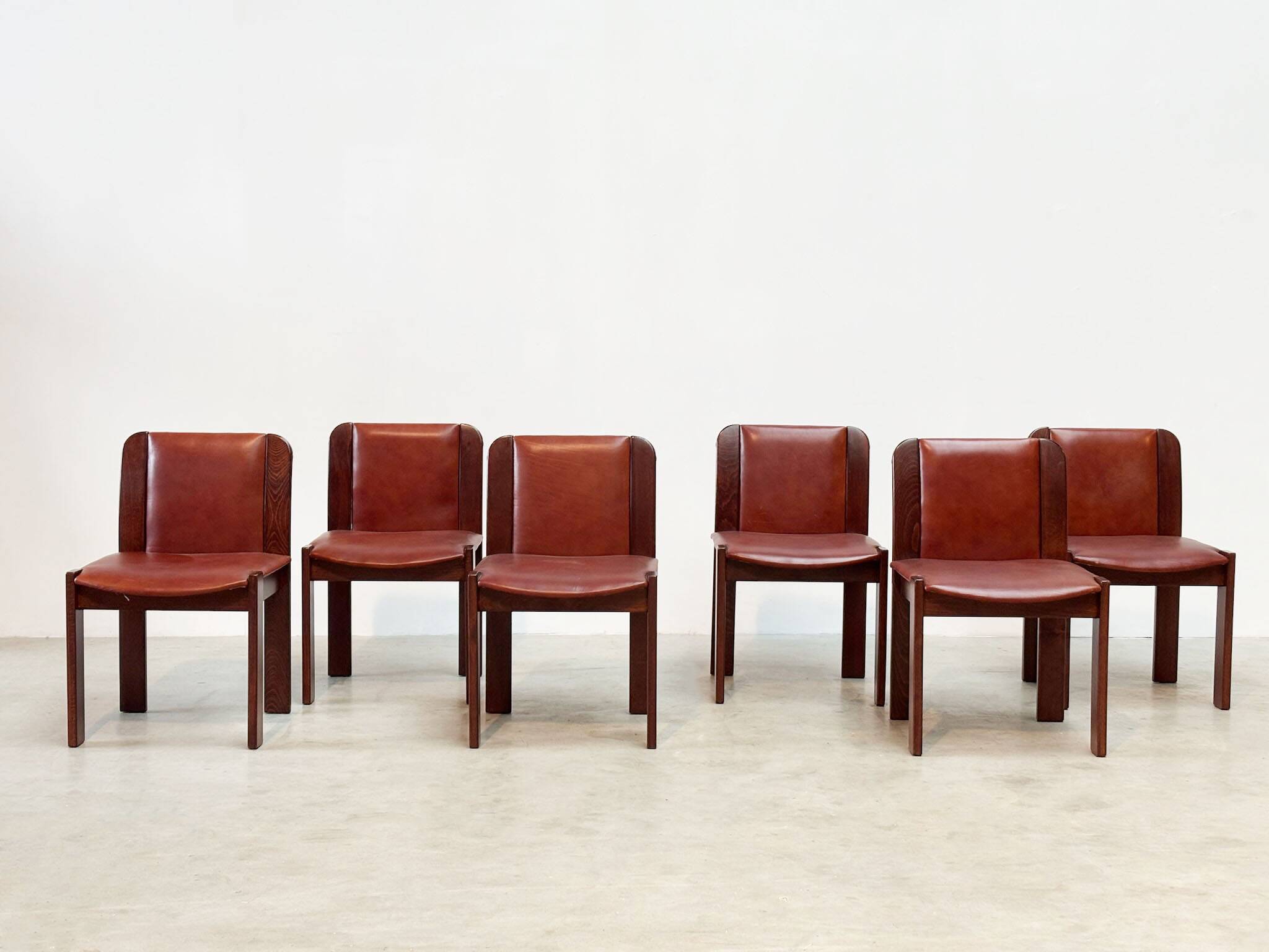 Set of six leather Italian dining chairs