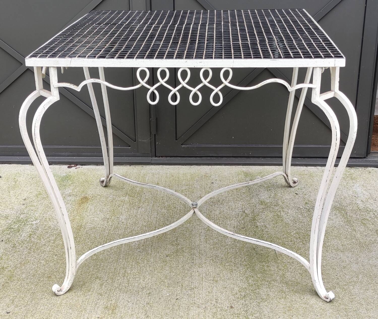 Old wrought iron table / ceramic tile top