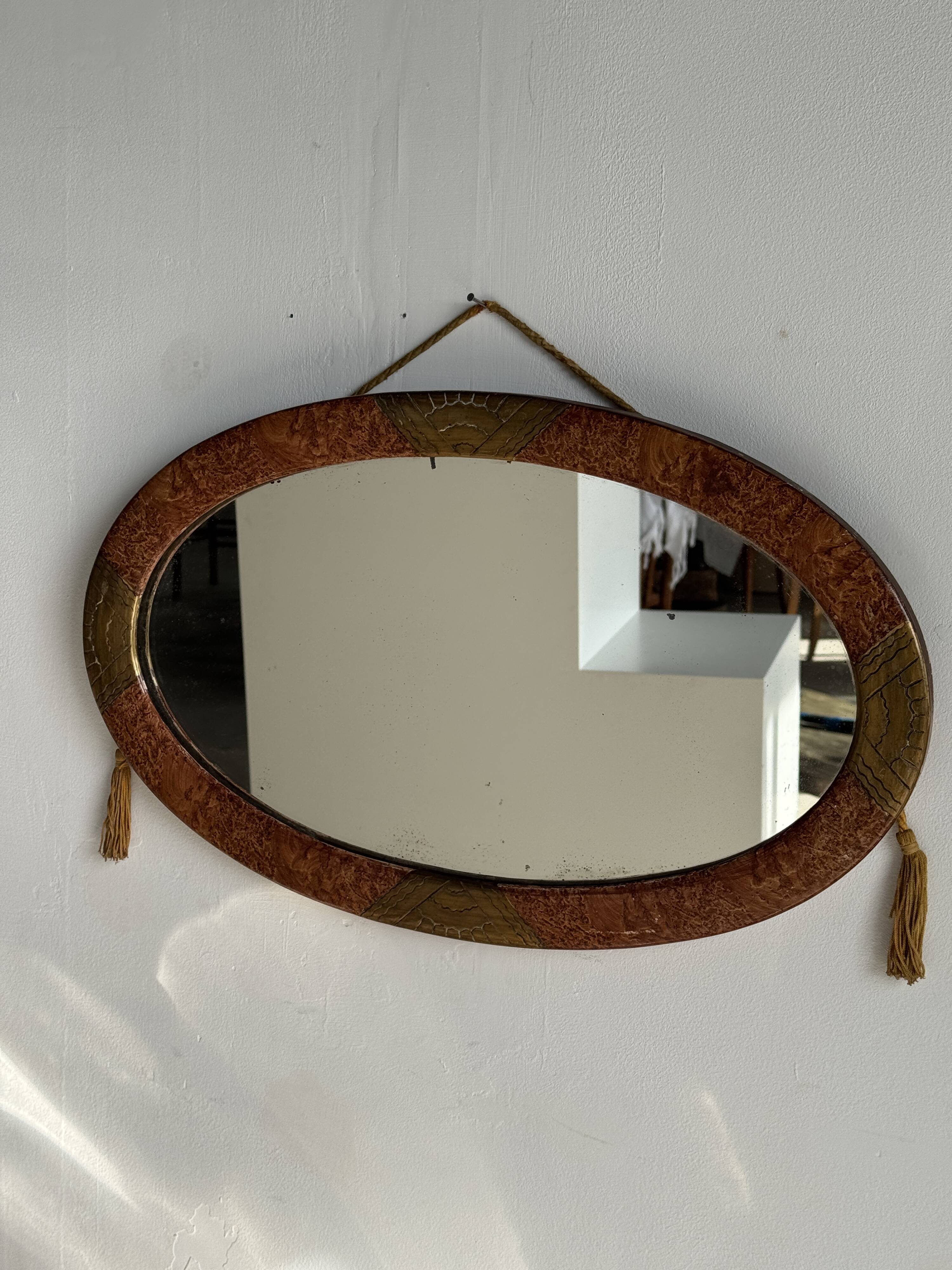 Small oval Art Deco mirror in brown and gold 33x54.