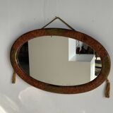 Small oval Art Deco mirror in brown and gold 33x54.