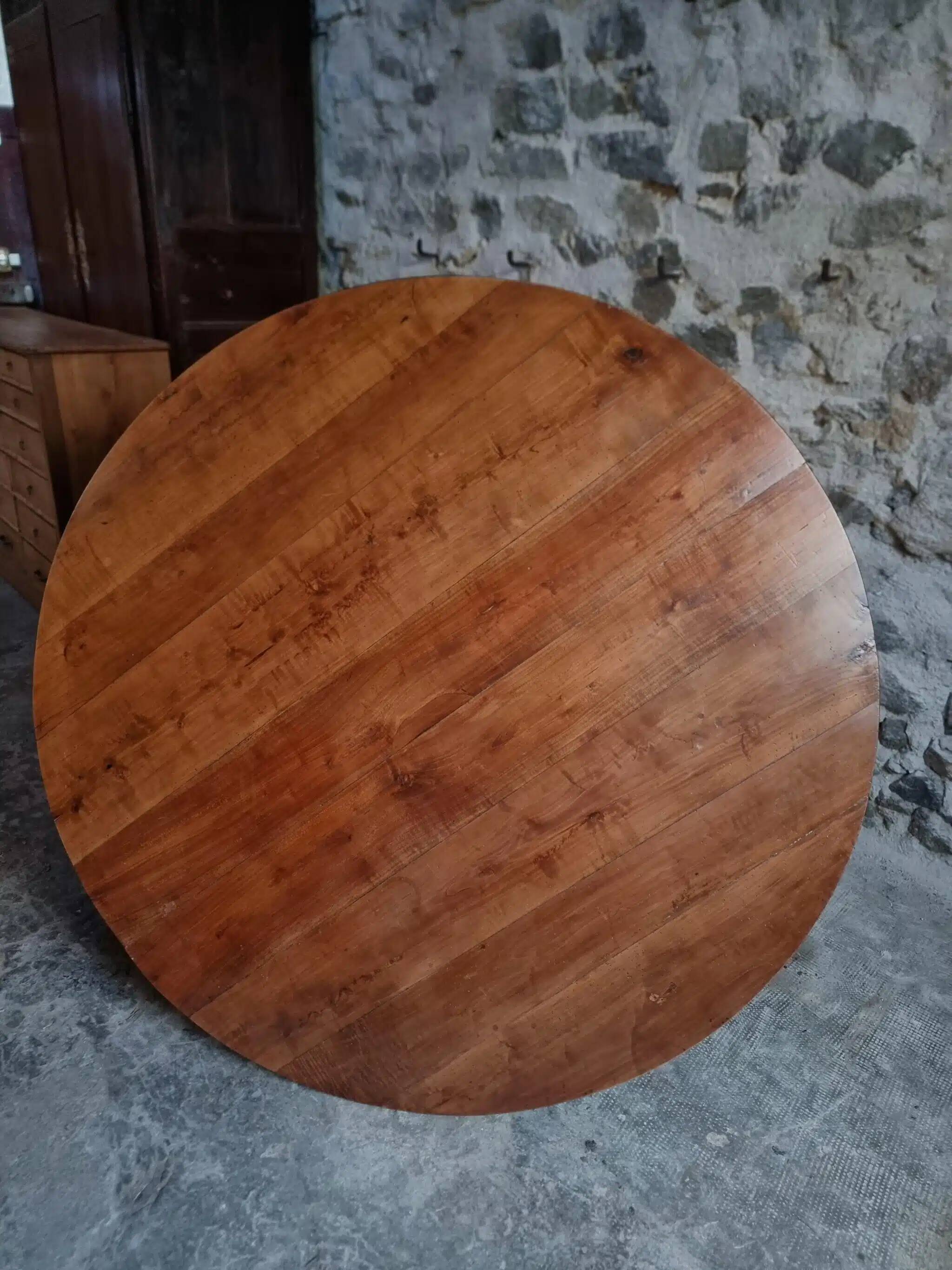 Antique round dining table in cherry wood, France, circa 1920.