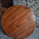Antique round dining table in cherry wood, France, circa 1920.