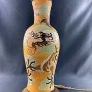 Very large dragon lamp on a yellow background in well-fired Vietnamese stoneware.