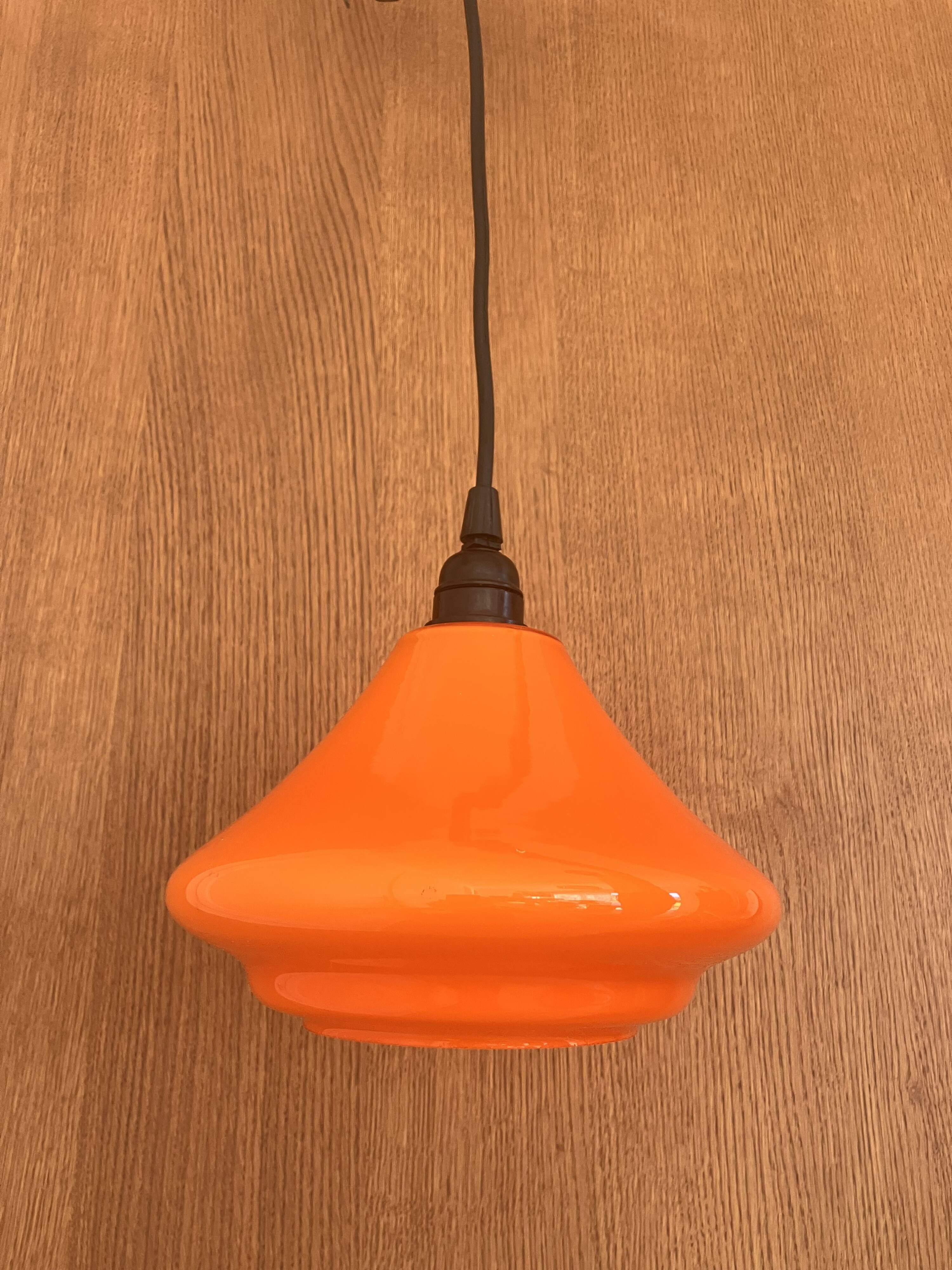 Set of three orange opaline suspensions from the 1970s Space Age.