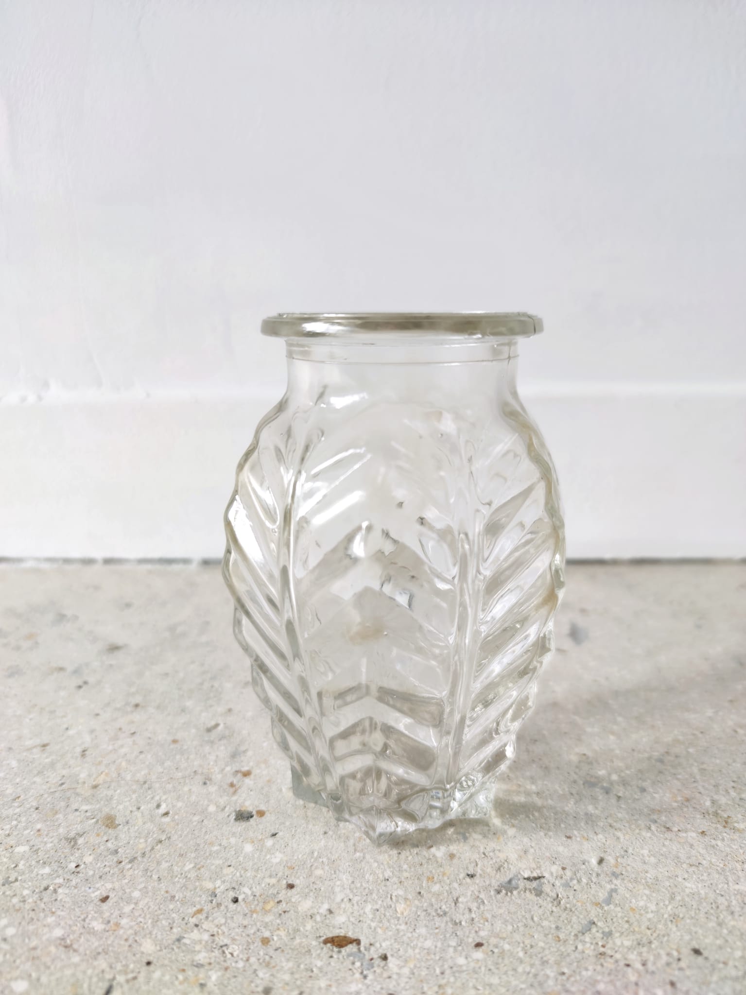 Small transparent molded glass vase