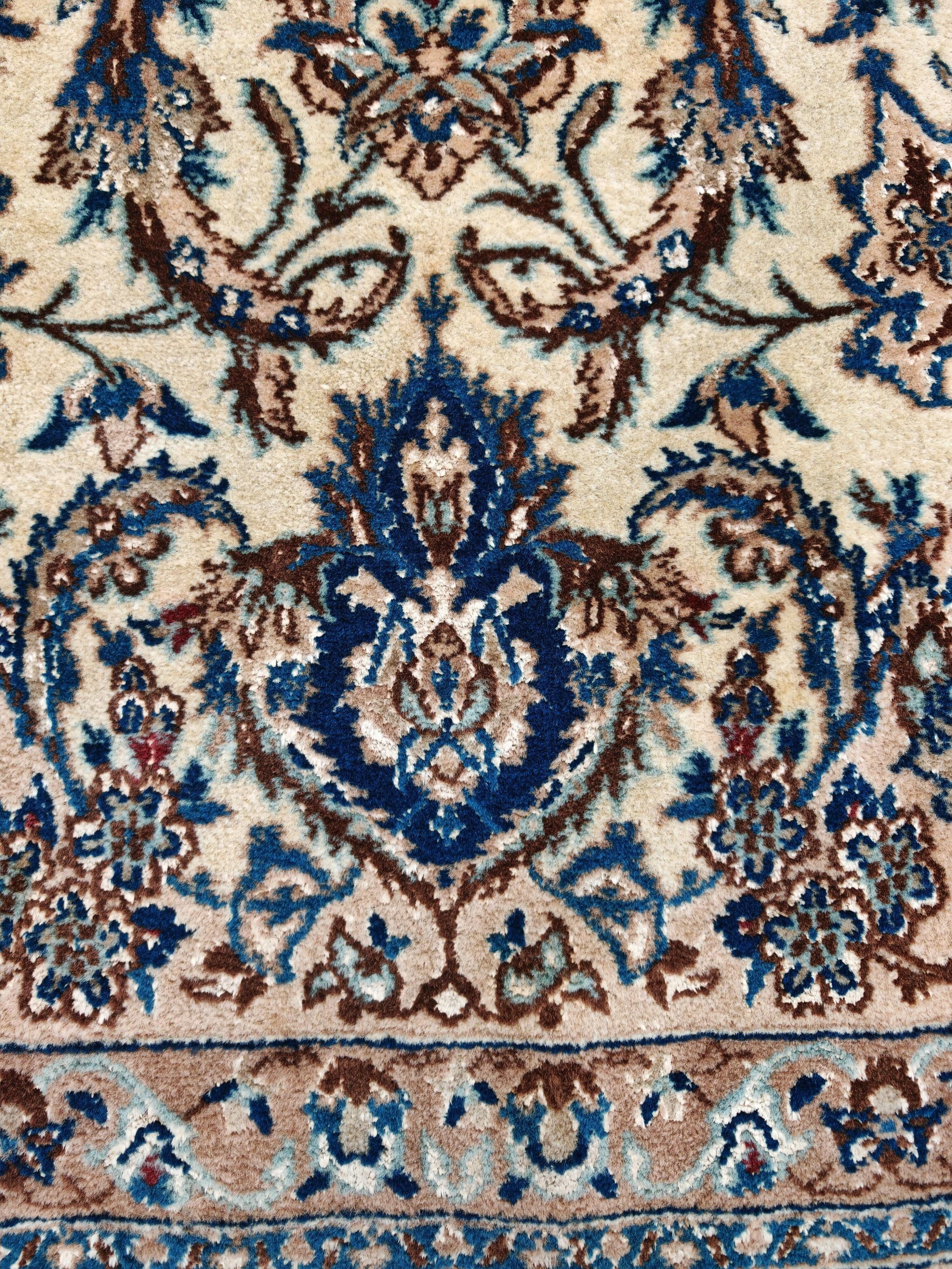 Vintage Persian Nain carpet, handwoven wool and silk from the 1940s.