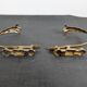 Pair of golden metal tiebacks