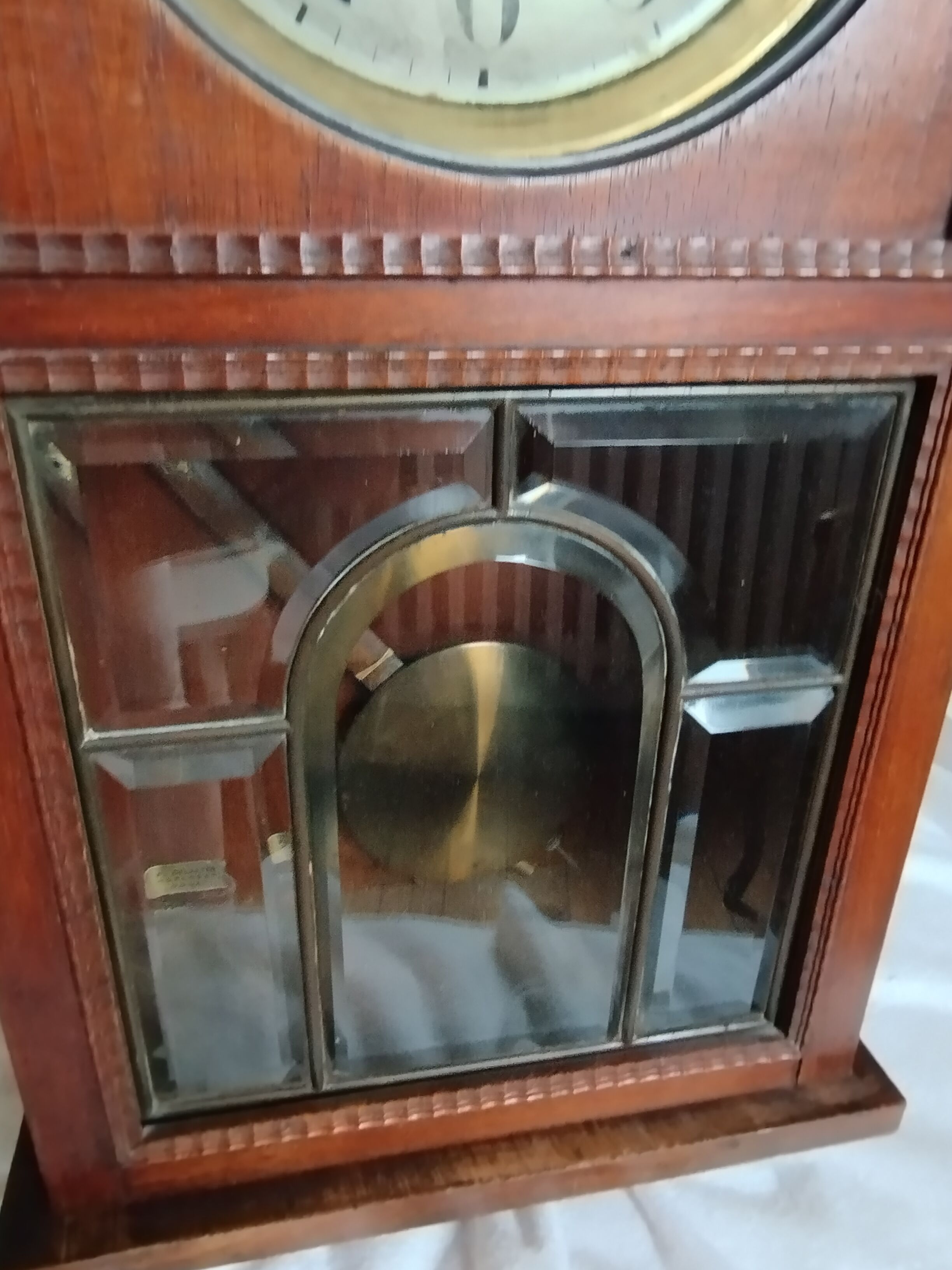 Wooden clock with beveled glass