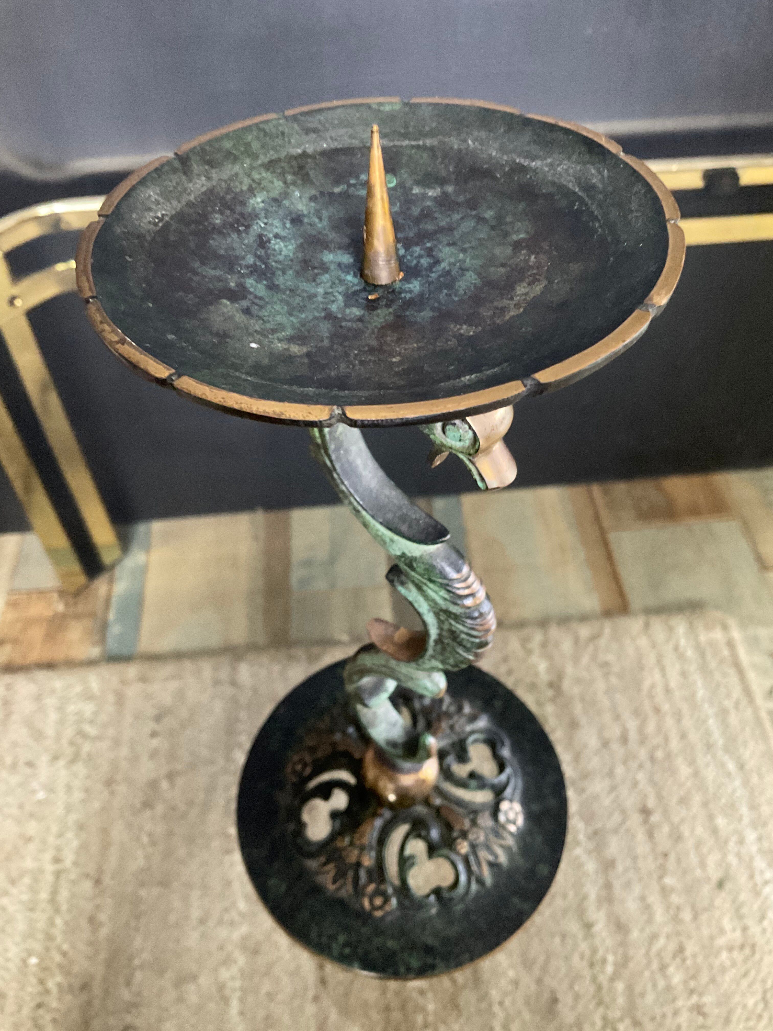 Empire style bronze candlestick with a candle holder